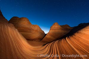 The Wave at Night, under a clear night sky full of stars.  The Wave, an area of fantastic eroded sandstone featuring beautiful swirls, wild colors, countless striations, and bizarre shapes set amidst the dramatic surrounding North Coyote Buttes of Arizona and Utah. The sandstone formations of the North Coyote Buttes, including the Wave, date from the Jurassic period. Managed by the Bureau of Land Management, the Wave is located in the Paria Canyon-Vermilion Cliffs Wilderness and is accessible on foot by permit only