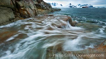 Waves rush in, Peterman Island, Antarctica