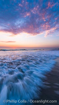 Waves rush in at sunset, Carlsbad beach sunset and ocean waves, seascape, dusk, summer.