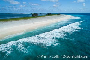 Waves break on the coral reef and wash ashore at Clipperton Island, aerial photo. Clipperton Island, a minor territory of France also known as Ile de la Passion, is a spectacular coral atoll in the eastern Pacific. By permit HC / 1485 / CAB (France)