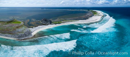 Waves break on the coral reef and wash ashore at Clipperton Island, aerial photo. Clipperton Island, a minor territory of France also known as Ile de la Passion, is a spectacular coral atoll in the eastern Pacific. By permit HC / 1485 / CAB (France)