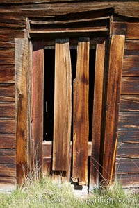 Weathered and broken old door, Kelley Building on Green Street, Bodie State Historical Park, California