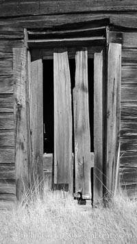 Weathered and broken old door, Kelley Building on Green Street, Bodie State Historical Park, California