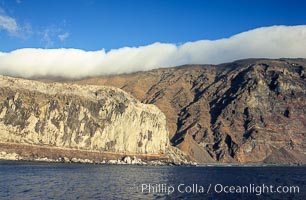 Clouds held back by island crest, near the north end of Guadalupe Island off the coast of Baja California, Mexico.