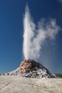 White Dome Geyser rises to a height of 30 feet or more, and typically erupts with an interval of 15 to 30 minutes.  It is located along Firehole Lake Drive, Lower Geyser Basin, Yellowstone National Park, Wyoming