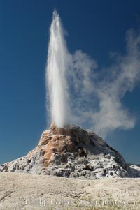 White Dome Geyser rises to a height of 30 feet or more, and typically erupts with an interval of 15 to 30 minutes.  It is located along Firehole Lake Drive, Lower Geyser Basin, Yellowstone National Park, Wyoming