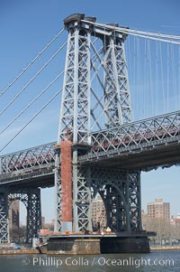 The Williamsburg Bridge viewed from the East River.  The Williamsburg Bridge is a suspension bridge in New York City across the East River connecting the Lower East Side of Manhattan at Delancey Street with the Williamsburg neighborhood of Brooklyn on Long Island at Broadway near the Brooklyn-Queens Expressway