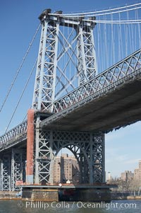 The Williamsburg Bridge viewed from the East River.  The Williamsburg Bridge is a suspension bridge in New York City across the East River connecting the Lower East Side of Manhattan at Delancey Street with the Williamsburg neighborhood of Brooklyn on Long Island at Broadway near the Brooklyn-Queens Expressway