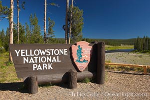 Yellowstone National Park, entrance sign at southern entrance, Snake River is visible in the background.