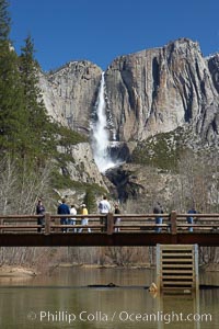 Visitors admire Yosemite Falls from the Swinging Bridge, Leidig Meadow.