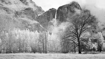 Yosemite Falls, mist and and storm clouds.
