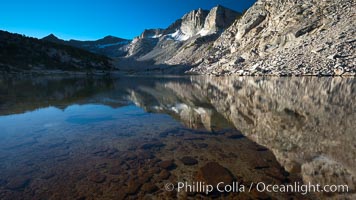 Cathedral Range peaks reflected in the still waters of Townsley Lake, Yosemite National Park, California