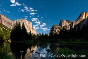 Yosemite Valley and stars lit by full moon, evening.