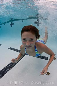 Young girl swimming in a pool