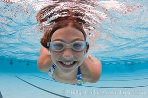 Young girl swimming in a pool