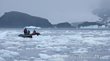 Zodiac cruising in Antarctica.  Motoring in an inflatable zodiac through pack ice along the Antarctic Peninsula, Cierva Cove