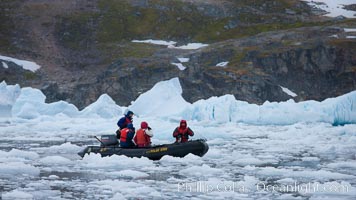 Zodiac cruising in Antarctica.  Motoring in an inflatable zodiac through pack ice along the Antarctic Peninsula, Cierva Cove