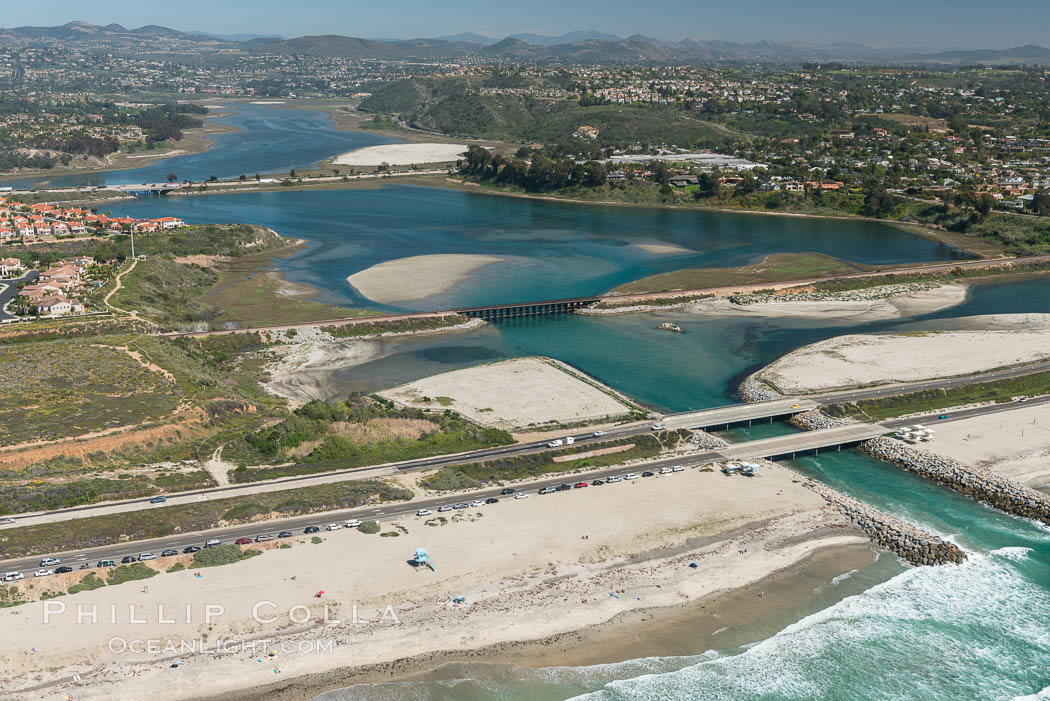 Aerial photo of Batiquitos Lagoon, Carlsbad. The Batiquitos Lagoon is a coastal wetland in southern Carlsbad, California. Part of the lagoon is designated as the Batiquitos Lagoon State Marine Conservation Area, run by the California Department of Fish and Game as a nature reserve. Callifornia, USA, natural history stock photograph, photo id 30554