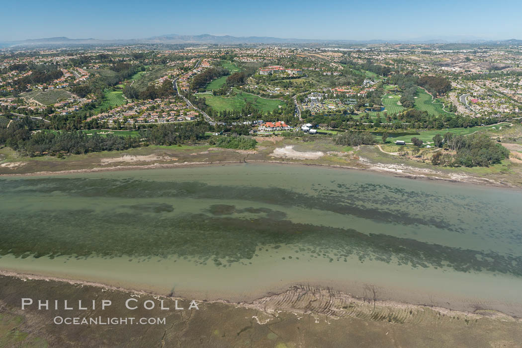 Aerial photo of Batiquitos Lagoon, Carlsbad. The Batiquitos Lagoon is a coastal wetland in southern Carlsbad, California. Part of the lagoon is designated as the Batiquitos Lagoon State Marine Conservation Area, run by the California Department of Fish and Game as a nature reserve. Callifornia, USA, natural history stock photograph, photo id 30562