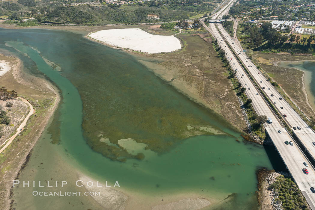 Aerial photo of Batiquitos Lagoon, Carlsbad. The Batiquitos Lagoon is a coastal wetland in southern Carlsbad, California. Part of the lagoon is designated as the Batiquitos Lagoon State Marine Conservation Area, run by the California Department of Fish and Game as a nature reserve. Callifornia, USA, natural history stock photograph, photo id 30566