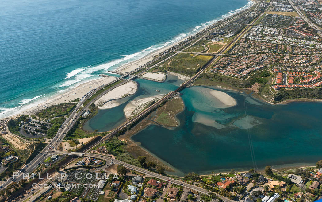 Aerial photo of Batiquitos Lagoon, Carlsbad. The Batiquitos Lagoon is a coastal wetland in southern Carlsbad, California. Part of the lagoon is designated as the Batiquitos Lagoon State Marine Conservation Area, run by the California Department of Fish and Game as a nature reserve. Callifornia, USA, natural history stock photograph, photo id 30572