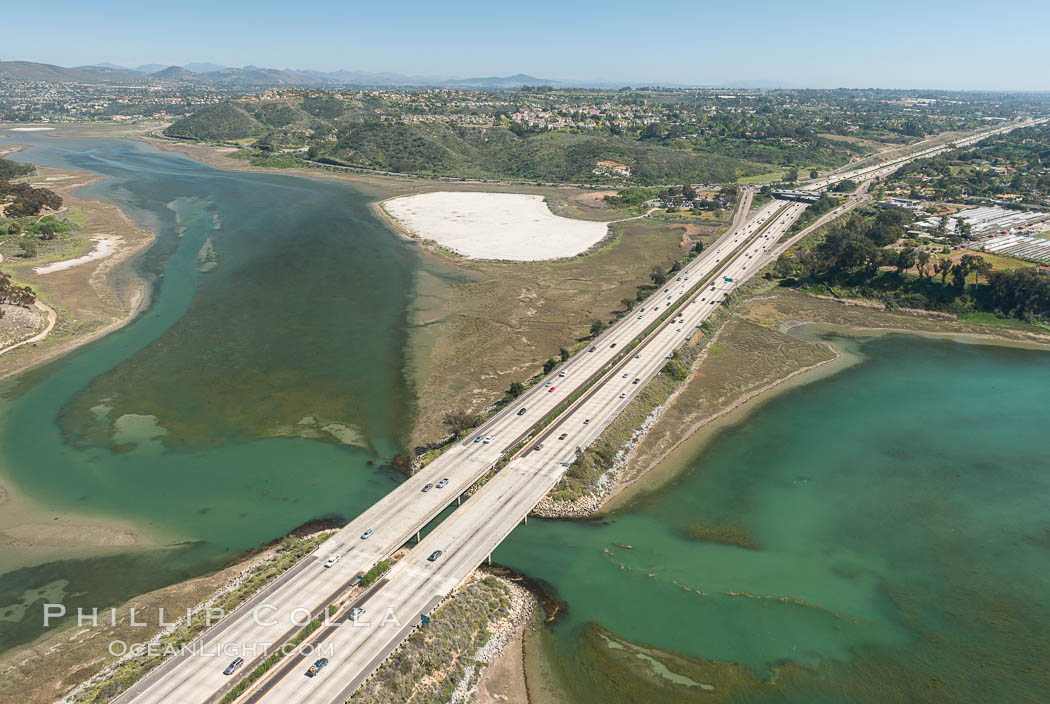 Aerial photo of Batiquitos Lagoon, Carlsbad. The Batiquitos Lagoon is a coastal wetland in southern Carlsbad, California. Part of the lagoon is designated as the Batiquitos Lagoon State Marine Conservation Area, run by the California Department of Fish and Game as a nature reserve. Callifornia, USA, natural history stock photograph, photo id 30567