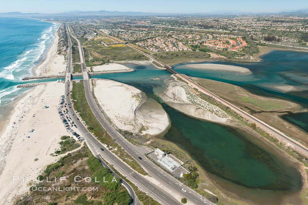 Aerial photo of Batiquitos Lagoon, Carlsbad. The Batiquitos Lagoon is a coastal wetland in southern Carlsbad, California. Part of the lagoon is designated as the Batiquitos Lagoon State Marine Conservation Area, run by the California Department of Fish and Game as a nature reserve. Callifornia, USA, natural history stock photograph, photo id 30557