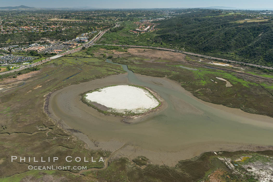 Aerial photo of Batiquitos Lagoon, Carlsbad. The Batiquitos Lagoon is a coastal wetland in southern Carlsbad, California. Part of the lagoon is designated as the Batiquitos Lagoon State Marine Conservation Area, run by the California Department of Fish and Game as a nature reserve. Callifornia, USA, natural history stock photograph, photo id 30565