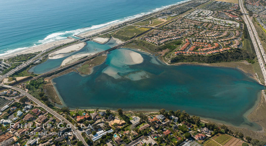 Aerial photo of Batiquitos Lagoon, Carlsbad. The Batiquitos Lagoon is a coastal wetland in southern Carlsbad, California. Part of the lagoon is designated as the Batiquitos Lagoon State Marine Conservation Area, run by the California Department of Fish and Game as a nature reserve. Callifornia, USA, natural history stock photograph, photo id 30665