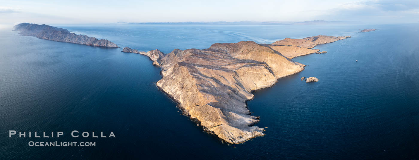Aerial photo of Islas San Lorenzo in the Sea of Cortez. San Lorenzo Marine Archipelago National Park is a national park of Mexico located on San Lorenzo Island part of an archipelago in the Gulf of California off the eastern coast of Baja California. The San Lorenzo Archipelago is considered one of the most important ecological areas of the Gulf of California. The Island and surrounding areas are part of a rich ecosystem comprised by a grand variety of flora and marine fauna. This area is protected by the Mexican federal government Norma Oficial Mexicana because of its importance as a habitat for several endangered species Aerial photo of Islas San Lorenzo in the Sea of Cortez. San Lorenzo Marine Archipelago National Park is a national park of Mexico located on San Lorenzo Island part of an archipelago in the Gulf of California off the eastern coast of Baja California. The San Lorenzo Archipelago is considered one of the most important ecological areas of the Gulf of California. The Island and surrounding areas are part of a rich ecosystem comprised by a grand variety of flora and marine fauna. This area is protected by the Mexican federal government Norma Oficial Mexicana because of its importance as a habitat for several endangered species