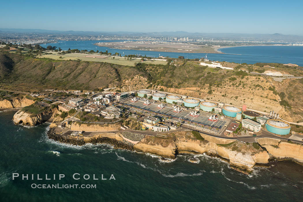 Point Loma Wastewater Treatment Plant and Fort Rosecrans, Point Loma. Opened in 1963, the Point Loma Wastewater Treatment Plant treats approximately 175 million gallons of wastewater per day, generated by 2.2 million residents of San Diego over a 450 square mile area. San Diego Bay, Coronado Island and downtown San Diego are seen in the distance., natural history stock photograph, photo id 30758