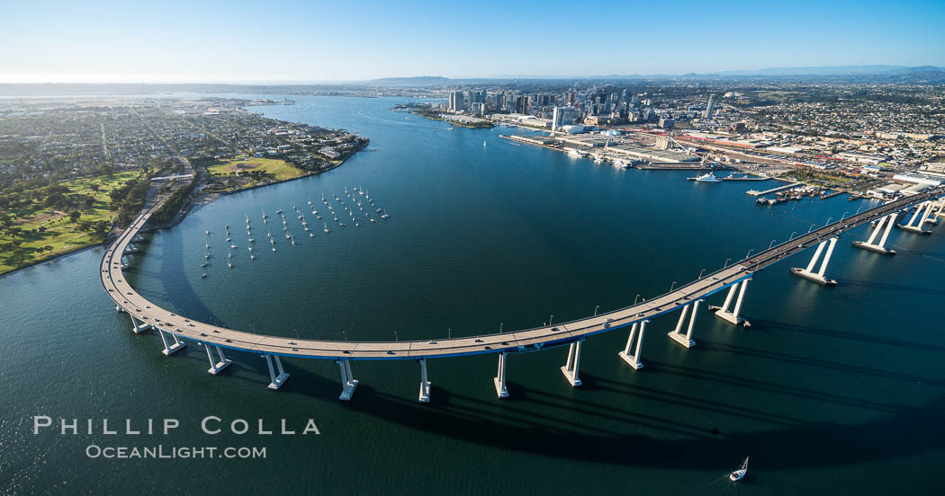 Aerial Photo of San Diego Coronado Bridge, known locally as the Coronado Bridge, links San Diego with Coronado, California. The bridge was completed in 1969 and was a toll bridge until 2002. It is 2.1 miles long and reaches a height of 200 feet above San Diego Bay. Coronado Island is to the left, and downtown San Diego is to the right in this view looking north., natural history stock photograph, photo id 30762