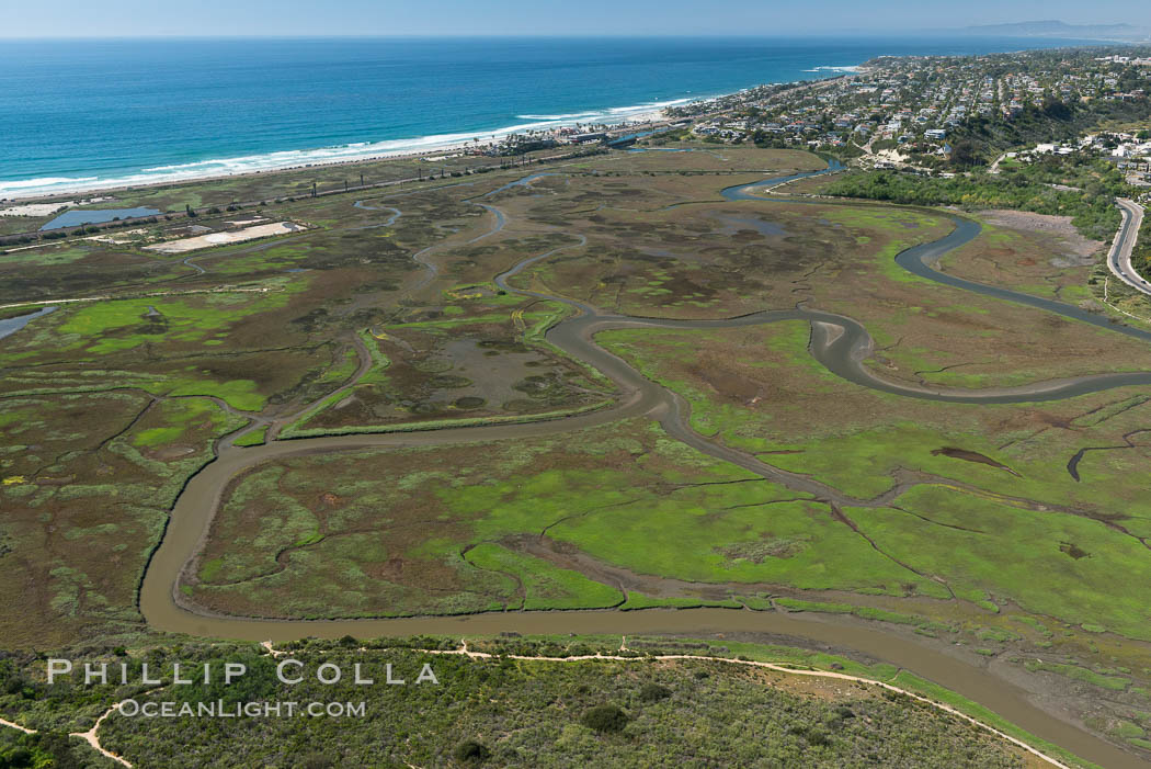 Image 30585, Aerial Photo of San Elijo Lagoon. San Elijo Lagoon Ecological Reserve is one of the largest remaining coastal wetlands in San Diego County, California, on the border of Encinitas, Solana Beach and Rancho Santa Fe. USA, Phillip Colla, all rights reserved worldwide. Keywords: above, aerial, aerial photo, aerial photograph, aloft, california, coast, encinitas, lagoon, lighthawk, marine, marine protected area, marsh, mpa, ocean, outdoors, outside, san diego, san elijo lagoon, san elijo lagoon ecological reserve, scene, scenery, scenic, usa, wetland.