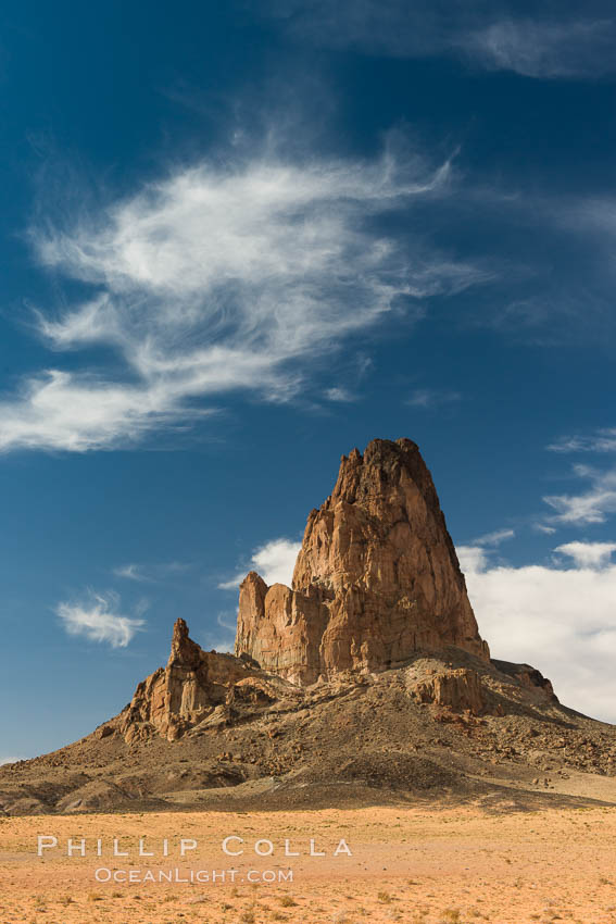 Agaltha Peak, also know as El Capitan Peak, rises to over 1500' in height near Kayenta, Arizona and Monument Valley.  Agathla Peak is an eroded volcanic plug consisting of volcanic breccia cut by dikes of an unusual igneous rock called minette. USA, natural history stock photograph, photo id 28552