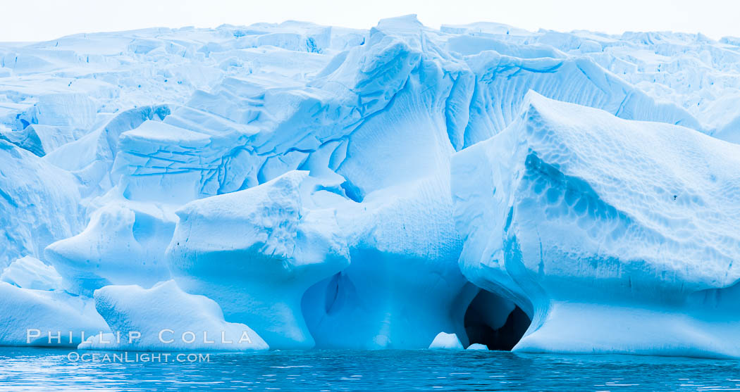 Antarctic icebergs, sculpted by ocean tides into fantastic shapes. Cierva Cove, Antarctic Peninsula, Antarctica, natural history stock photograph, photo id 25588