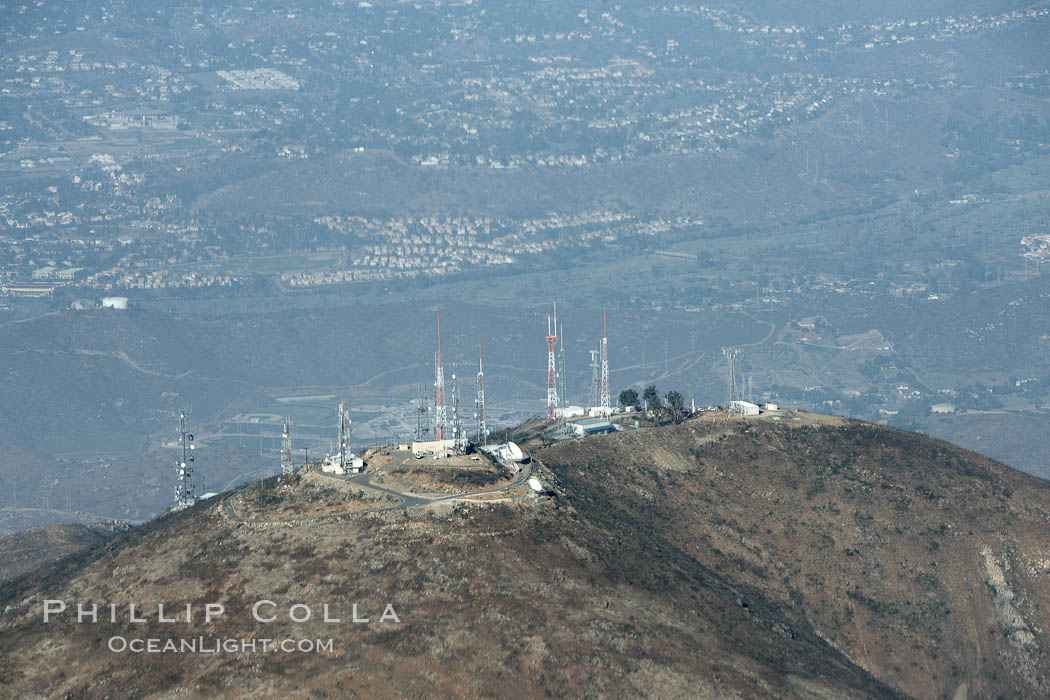 Antenna towers atop San Miguel Mountain, aerial view.  San Miguel Mountain reaches an altitude of 2565 feet, and hosts commercial radio and television antennas for the San Diego region, east of downtown San Diego. California, USA, natural history stock photograph, photo id 22141