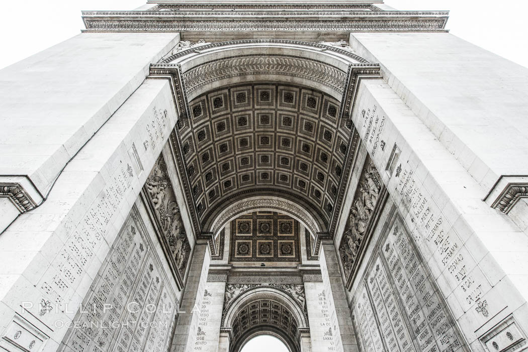 Arc de Triomphe. The Arc de Triomphe (Arc de Triomphe de l'Etoile) is one of the most famous monuments in Paris. It stands in the centre of the Place Charles de Gaulle (originally named Place de l'Etoile), at the western end of the Champs-Elysees. The Arc de Triomphe (in English: "Triumphal Arch") honors those who fought and died for France in the French Revolutionary and the Napoleonic Wars, with the names of all French victories and generals inscribed on its inner and outer surfaces. Beneath its vault lies the Tomb of the Unknown Soldier from World War I. The monument was designed by Jean Chalgrin in 1806, and its iconographic program pitted heroically nude French youths against bearded Germanic warriors in chain mail. It set the tone for public monuments, with triumphant patriotic messages. The monument stands 50 metres (164 ft) in height, 45 m (148 ft) wide and 22 m (72 ft) deep., natural history stock photograph, photo id 28086