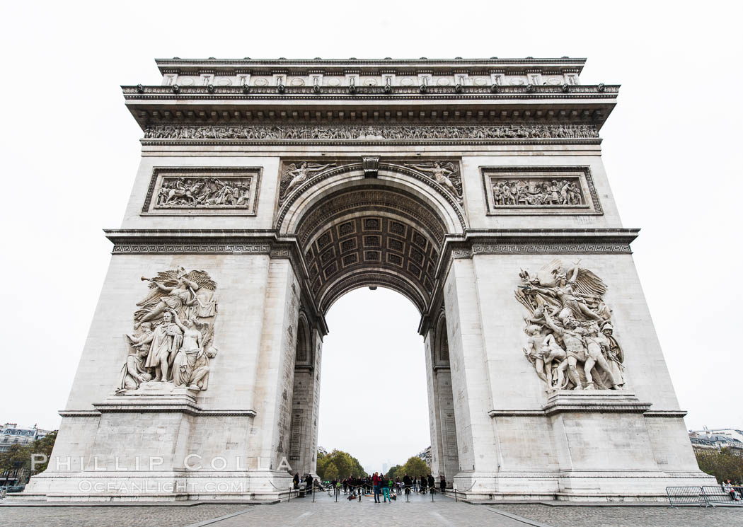 Arc de Triomphe. The Arc de Triomphe (Arc de Triomphe de l'Etoile) is one of the most famous monuments in Paris. It stands in the centre of the Place Charles de Gaulle (originally named Place de l'Etoile), at the western end of the Champs-Elysees. The Arc de Triomphe (in English: "Triumphal Arch") honors those who fought and died for France in the French Revolutionary and the Napoleonic Wars, with the names of all French victories and generals inscribed on its inner and outer surfaces. Beneath its vault lies the Tomb of the Unknown Soldier from World War I. The monument was designed by Jean Chalgrin in 1806, and its iconographic program pitted heroically nude French youths against bearded Germanic warriors in chain mail. It set the tone for public monuments, with triumphant patriotic messages. The monument stands 50 metres (164 ft) in height, 45 m (148 ft) wide and 22 m (72 ft) deep., natural history stock photograph, photo id 28084