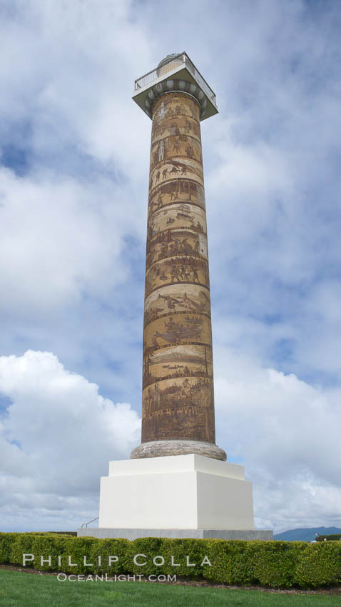 The Astoria Column rises 125 feet above Coxcomb Hill, site of the first permanent American Settlement west of the Rockies, itself 600 feet above Astoria.  It was erected in 1926 and has been listed in the National Register of Historic Places since 1974.  The column displays 14 scenes commemorating important events in the history of Astoria in cronological order. An interior 164-step spiral staircase leads to the top of a viewing platform with spectacular views. Oregon, USA, natural history stock photograph, photo id 19445