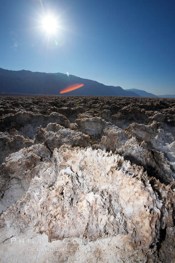 Devils Golf Course, California.  Evaporated salt has formed into gnarled, complex crystalline shapes in on the salt pan of Death Valley National Park, one of the largest salt pans in the world.  The shapes are constantly evolving as occasional floods submerge the salt concretions before receding and depositing more salt. USA, natural history stock photograph, photo id 15599