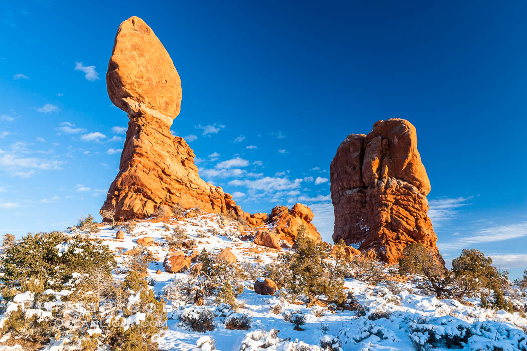 Balanced Rock, a narrow sandstone tower, appears poised to topple.  Sunset, winter. Arches National Park, Utah, USA, natural history stock photograph, photo id 18155