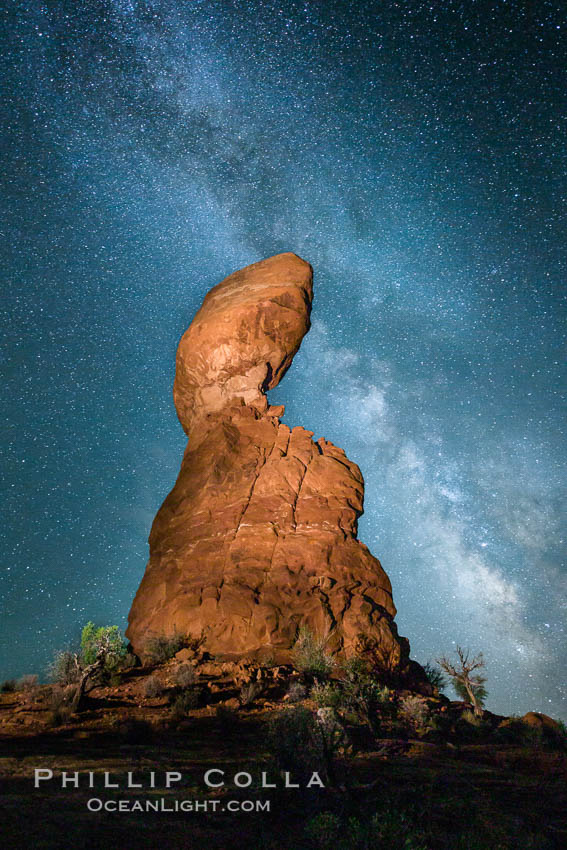 Balanced Rock and Milky Way stars at night. (Note: this image was created before a ban on light-painting in Arches National Park was put into effect.  Light-painting is no longer permitted in Arches National Park). Utah, USA, natural history stock photograph, photo id 27834