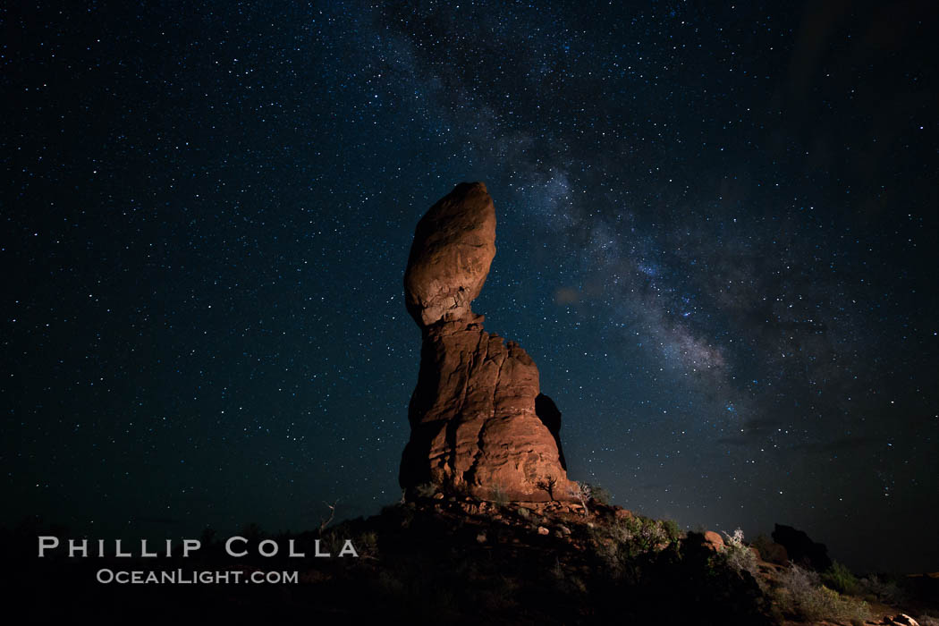 Balanced Rock and Milky Way stars at night. (Note: this image was created before a ban on light-painting in Arches National Park was put into effect.  Light-painting is no longer permitted in Arches National Park). Utah, USA, natural history stock photograph, photo id 27832