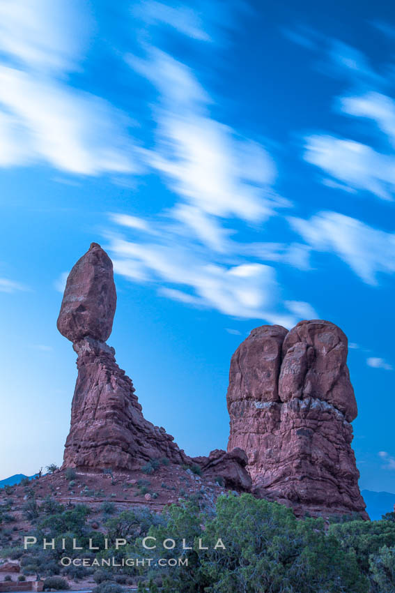 Balanced Rock, a narrow sandstone tower, appears poised to topple. Arches National Park, Utah, USA, natural history stock photograph, photo id 27837