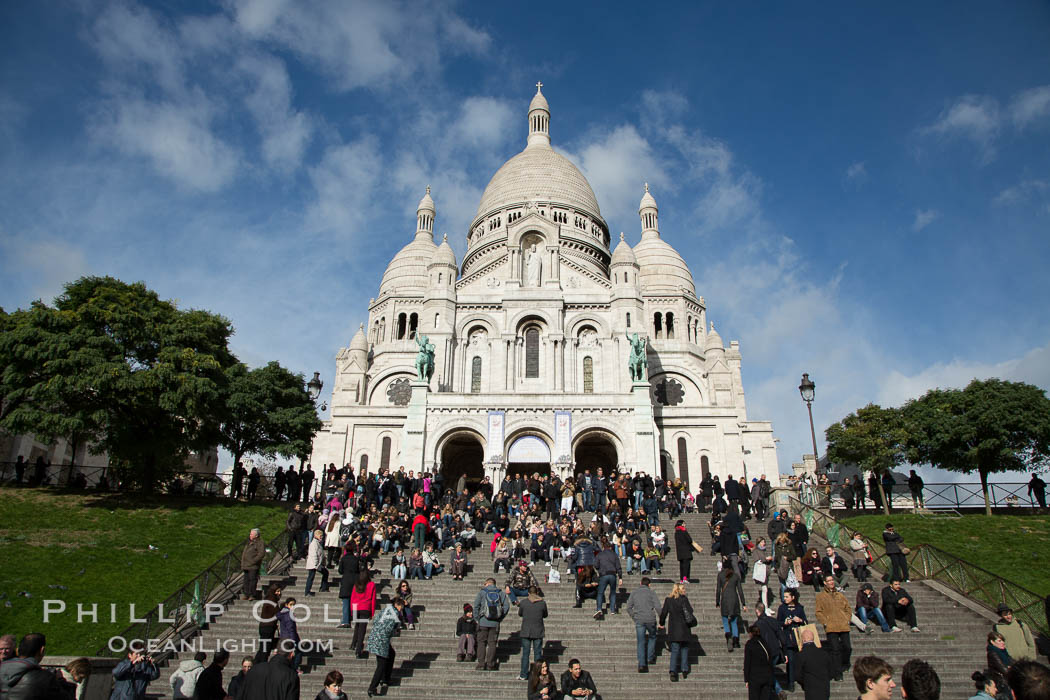 Sacre-Coeur Basilica.  The Basilica of the Sacred Heart of Paris, commonly known as Sacre-Coeur Basilica, is a Roman Catholic church and minor basilica, dedicated to the Sacred Heart of Jesus, in Paris, France. A popular landmark, the basilica is located at the summit of the butte Montmartre, the highest point in the city. Basilique du Sacre-Coeur, natural history stock photograph, photo id 28156