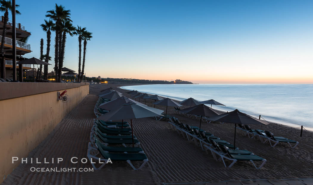 Beach chairs and umbrellas line the sand in front of resorts on Medano Beach, Cabo San Lucas, Mexico., natural history stock photograph, photo id 28945