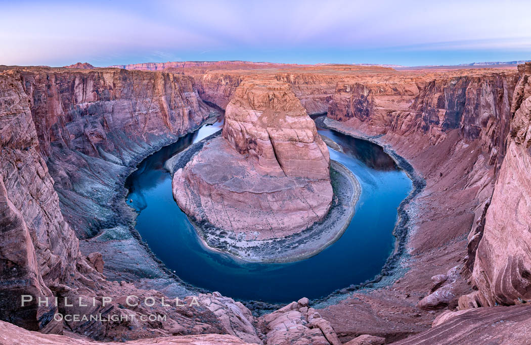 Belt of Venus over Horseshoe Bend on the Colorado River. The Colorado River makes a 180-degree turn at Horseshoe Bend. Here the river has eroded the Navajo sandstone for eons, digging a canyon 1100-feet deep. The Belt of Venus, or anti-twilight arch, is the shadow of the earth cast upon the atmosphere just above the horizon, and occurs a few minutes before sunrise or after sunset. Page, Arizona, USA, natural history stock photograph, photo id 37781