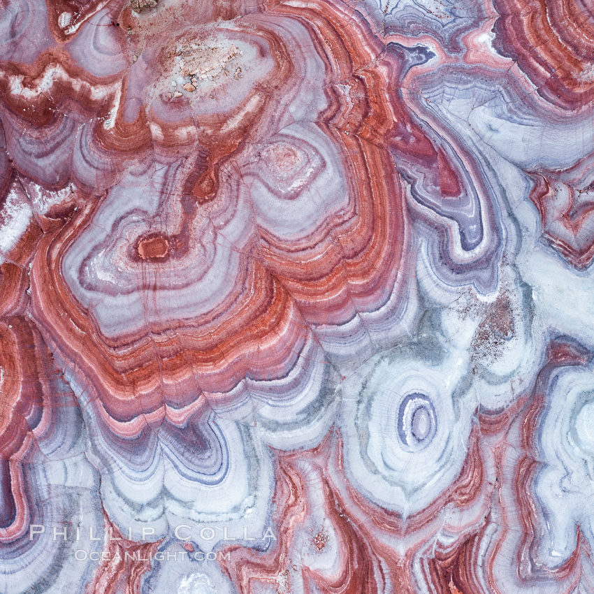 Fantastic colorful sedimentary patterns, Bentonite layers are seen as striations exposed in the Utah Badlands, part of the Brushy Basin shale member of the Morrison Formation. This layer was formed during Jurassic times when mud, silt, fine sand, and volcanic ash were deposited in swamps and lakes.  Aerial photograph. USA, natural history stock photograph, photo id 38020