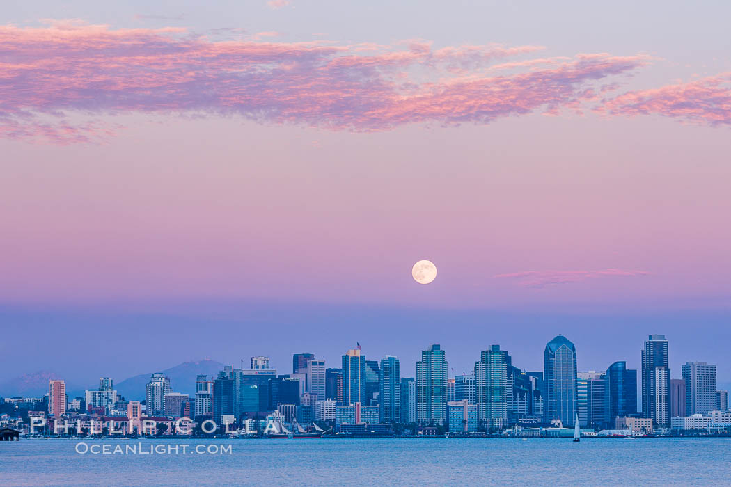 Blue Moon at Sunset over San Diego City Skyline.  The third full moon in a season, this rare "blue moon" rises over San Diego just after sundown. California, USA, natural history stock photograph, photo id 28754