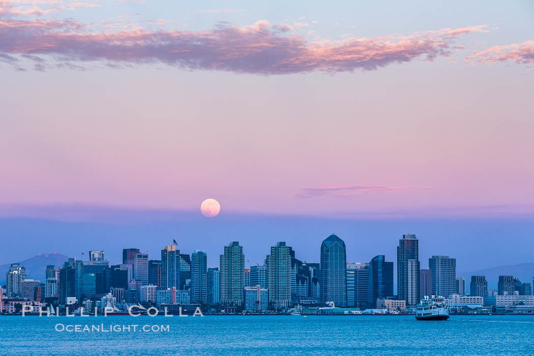 Blue Moon at Sunset over San Diego City Skyline.  The third full moon in a season, this rare "blue moon" rises over San Diego just after sundown. California, USA, natural history stock photograph, photo id 28752